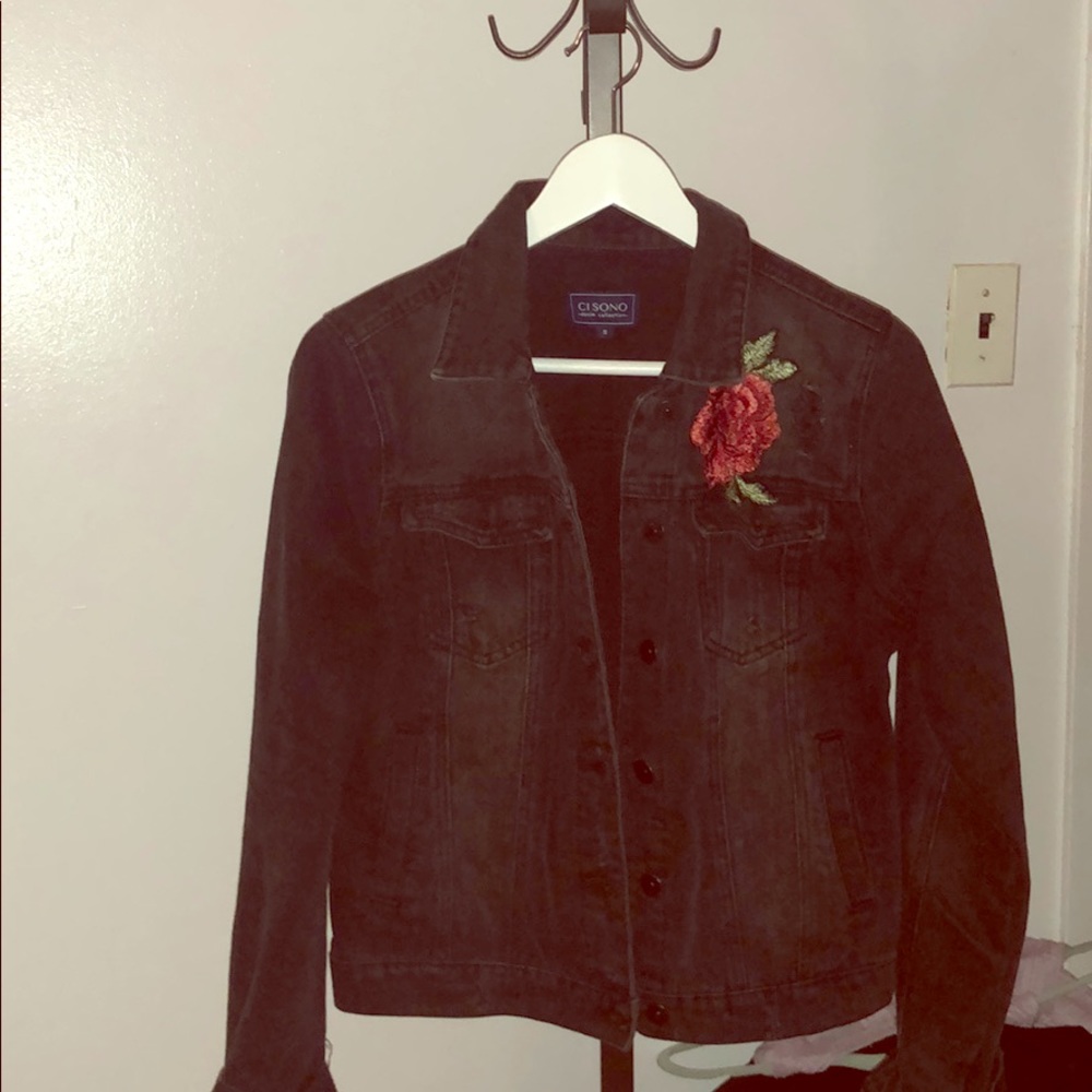 Jean jacket with flower patch. Super cute